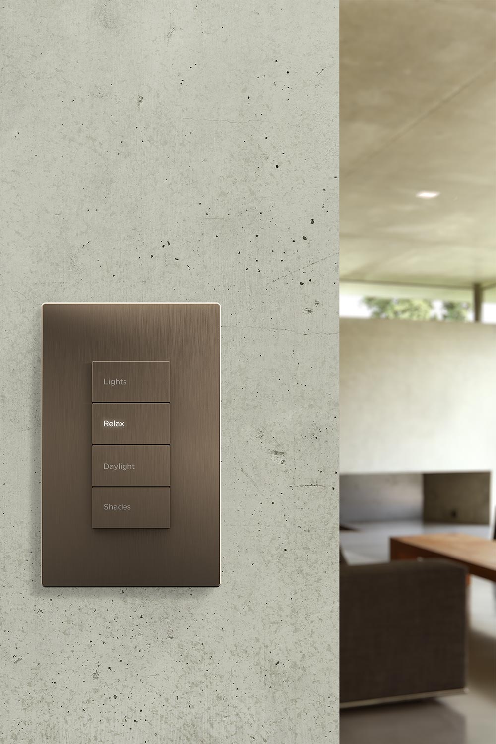 Wall mounted smart lighting keypad with scene buttons in a modern interior