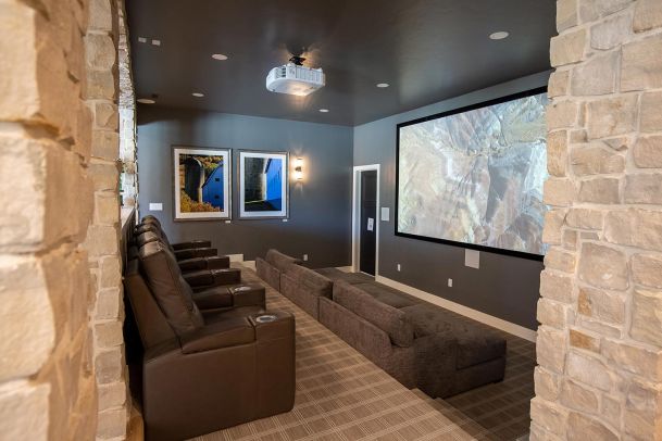 Home theater with leather recliners and large projection screen