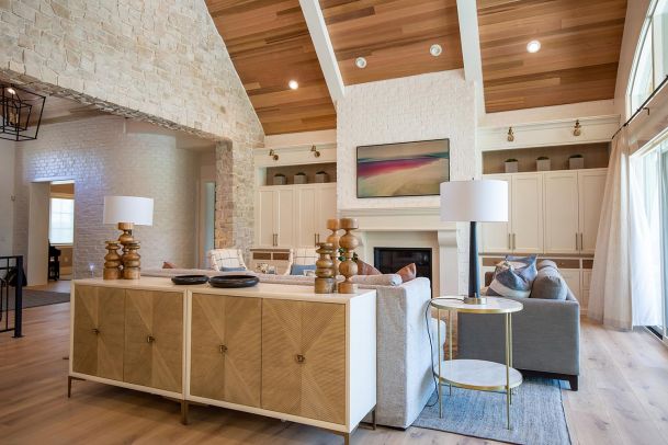 Spacious living area with vaulted wood ceiling and fireplace
