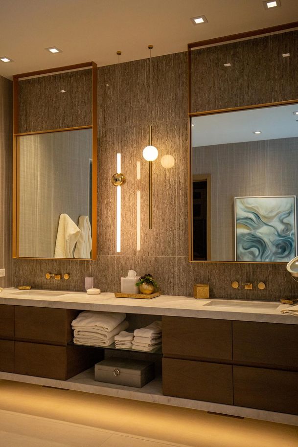 Double vanity bathroom with vertical light fixtures