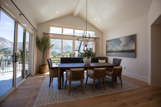 Dining room with vaulted ceiling and mountain views