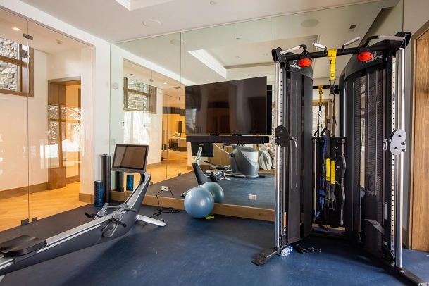Fitness room with rowing machine and functional trainer