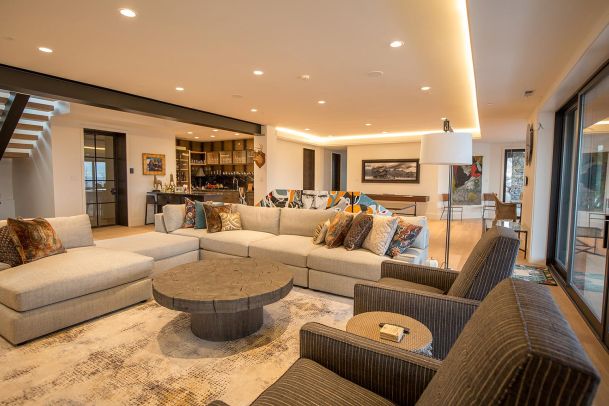 Lower level lounge with large sectional and pool table