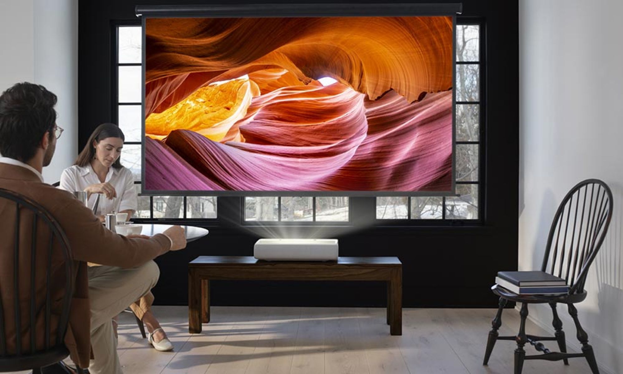 Short throw projector displaying a large image in a bright living space