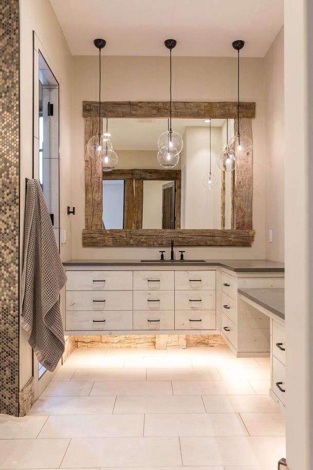 White vanity with vessel sink and glass pendant lights