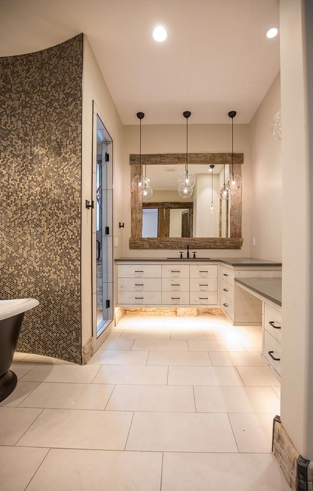 Bathroom with clawfoot tub and rustic wood mirror frame