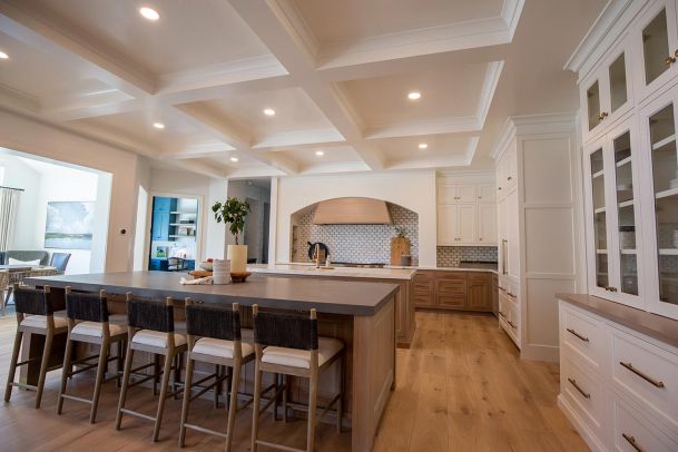 Large kitchen with coffered ceiling and dual islands