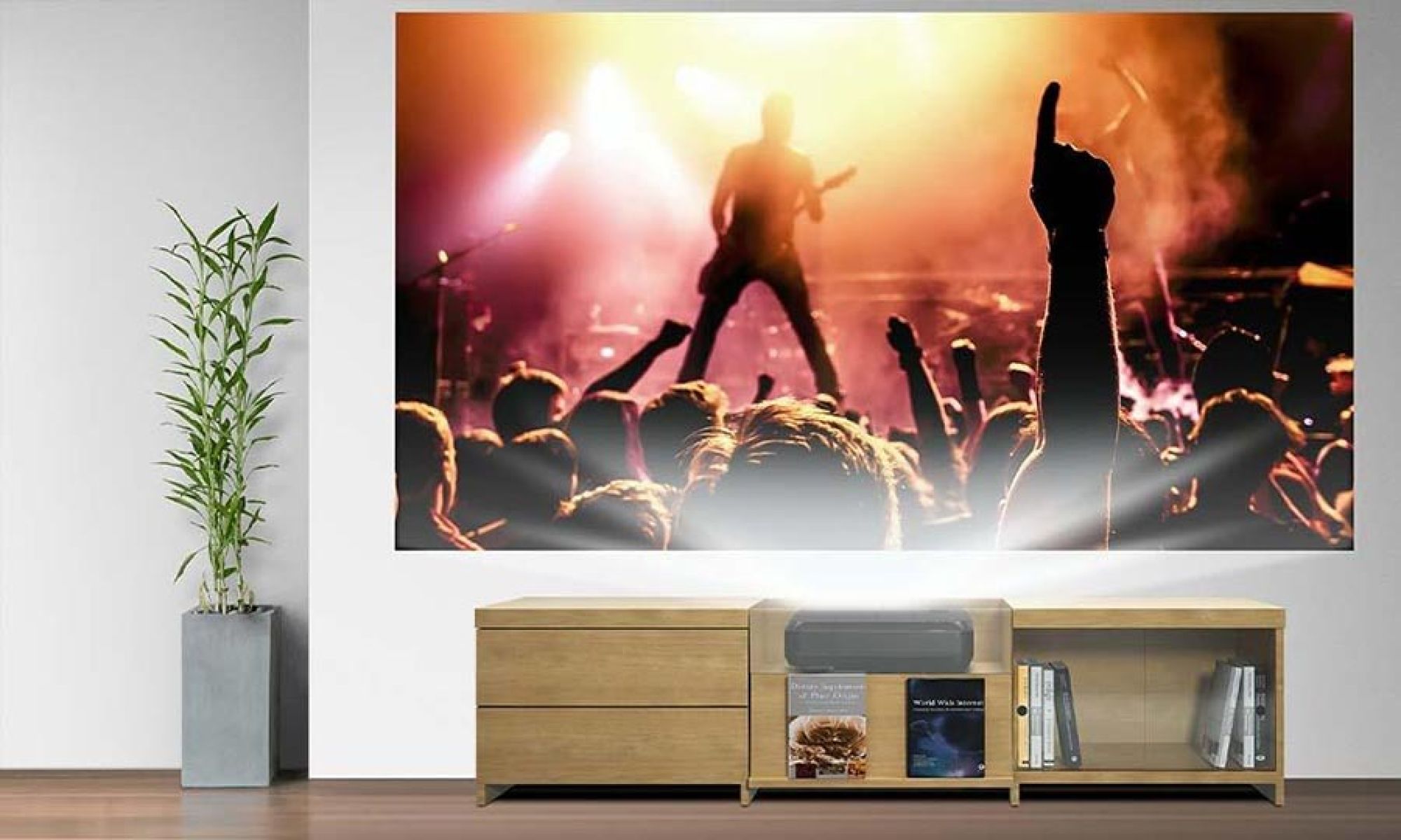 Living room with wall projection screen showing a live concert scene