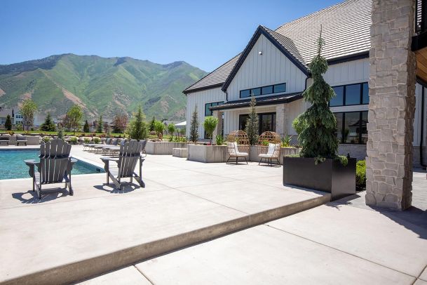 Outdoor patio with pool and mountain landscape